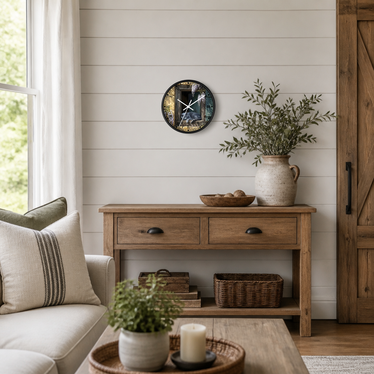 A round wall clock with a rustic, distressed wood-grain face and black hands, styled on a white shiplap wall above a wooden console table in a bright, modern farmhouse living room.