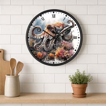 A round wall clock with a black frame and a detailed octopus and coral reef illustration, mounted on a white subway tile wall above a wooden shelf with kitchen utensils and a potted plant.