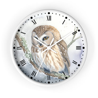 A round wall clock with a white frame and a printed illustration of a brown and cream owl perched on a branch. The clock face has black Roman numerals and white hands against a soft watercolor-style background.