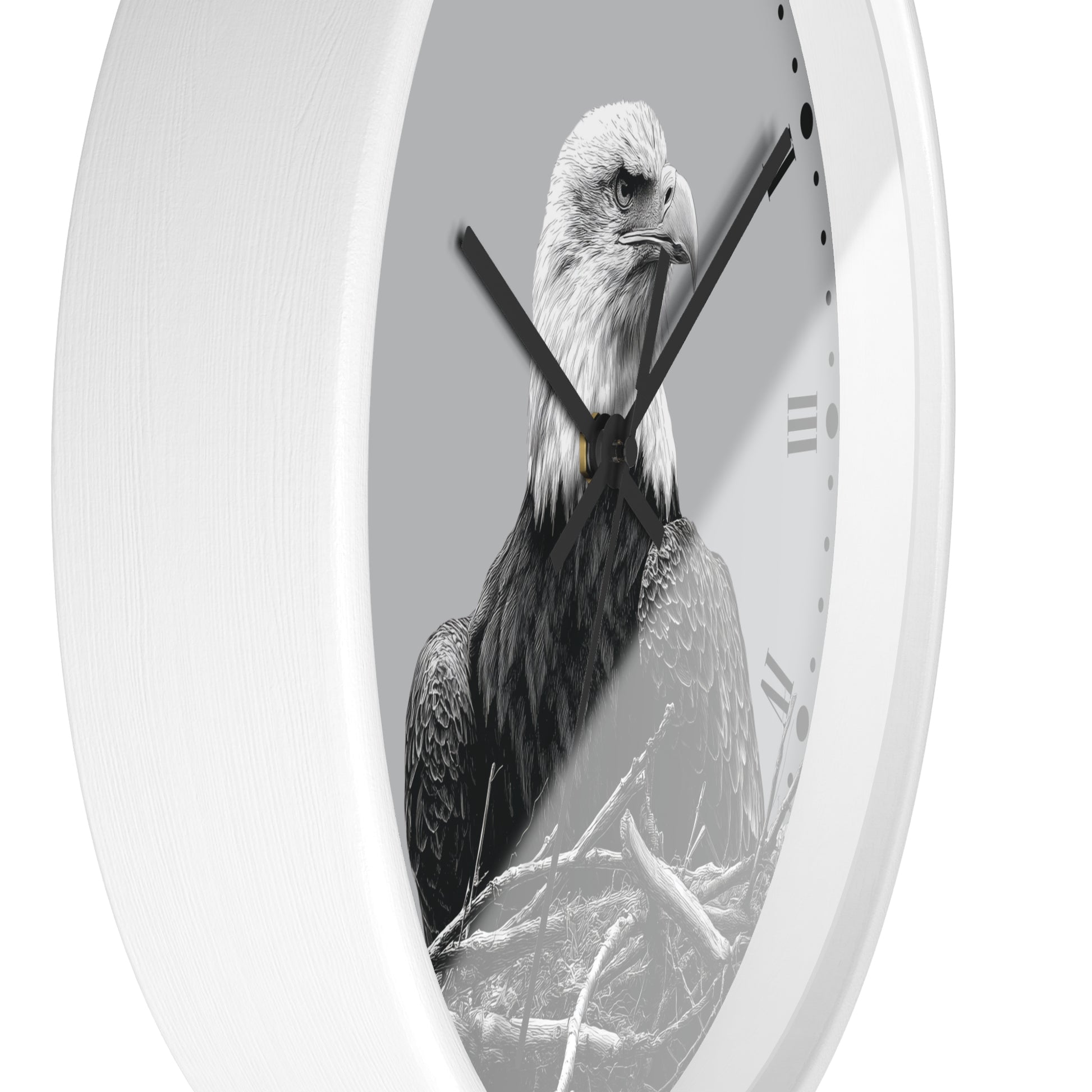 A white oval wall clock featuring a black and white photograph of a bald eagle on the clock face, with black hands and Roman numeral hour markers.