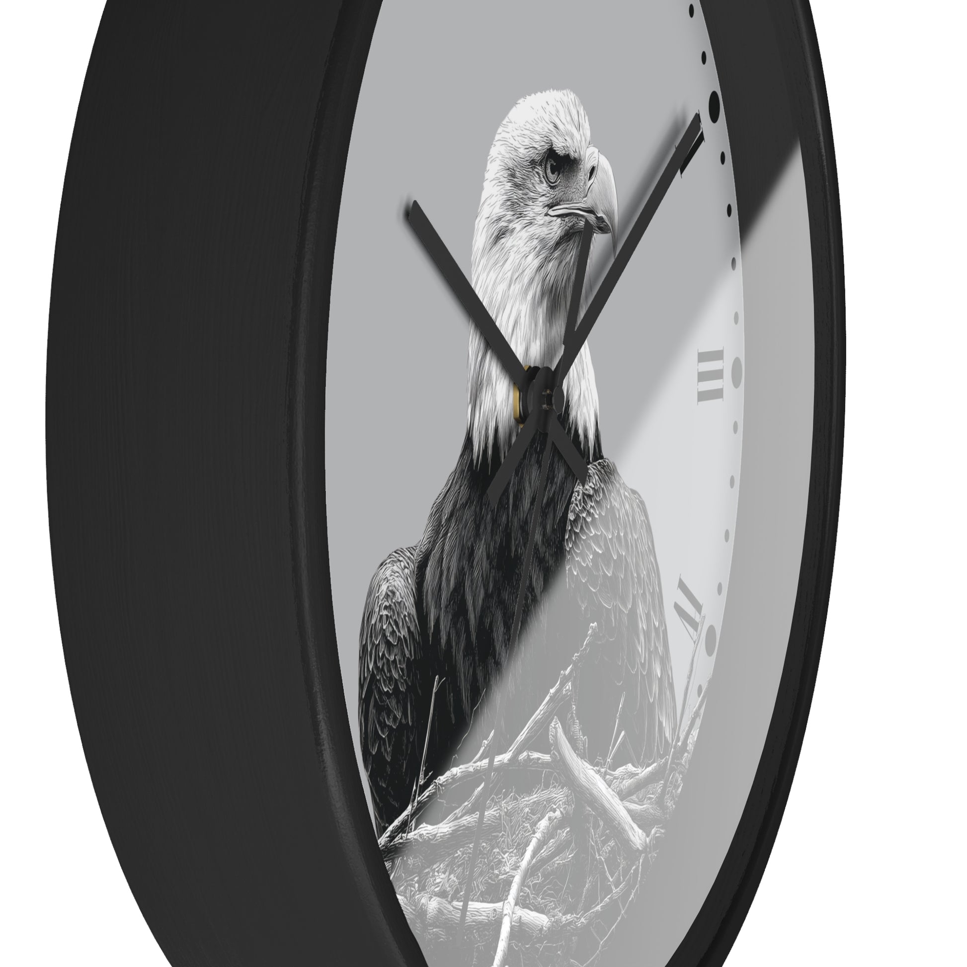 A round wall clock with a black frame and a monochrome photograph of a bald eagle on the face, with black hands and Roman numeral hour markers on a light gray background.
