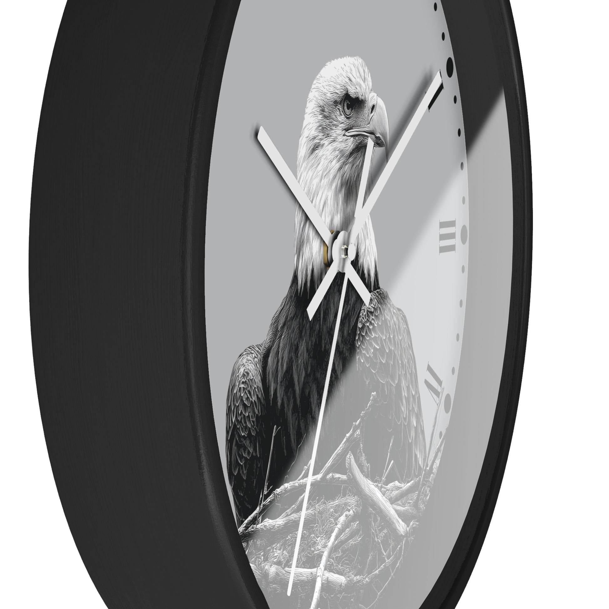 A round wall clock with a black frame and a monochrome photograph of a bald eagle on the face, with white clock hands and Roman numeral hour markers.