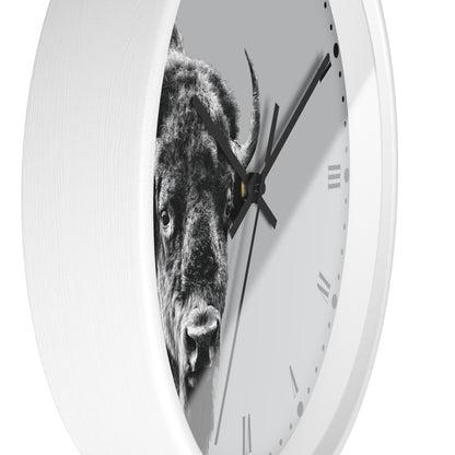 A white round wall clock with a black-and-white bull graphic printed across the face, shown against a plain white background.