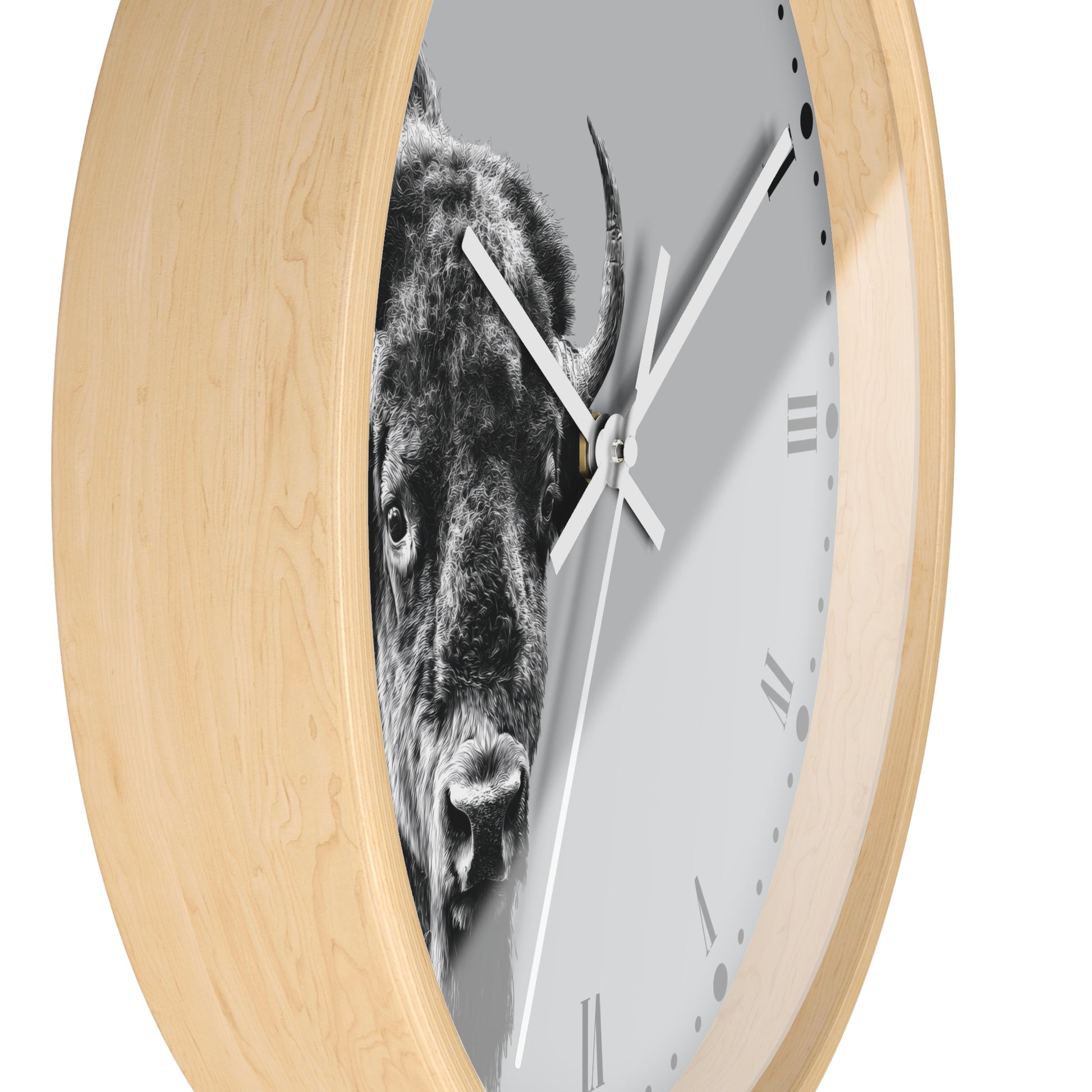 Round wall clock with a light natural wood frame and a white face featuring a black-and-white close-up photograph of a bison.