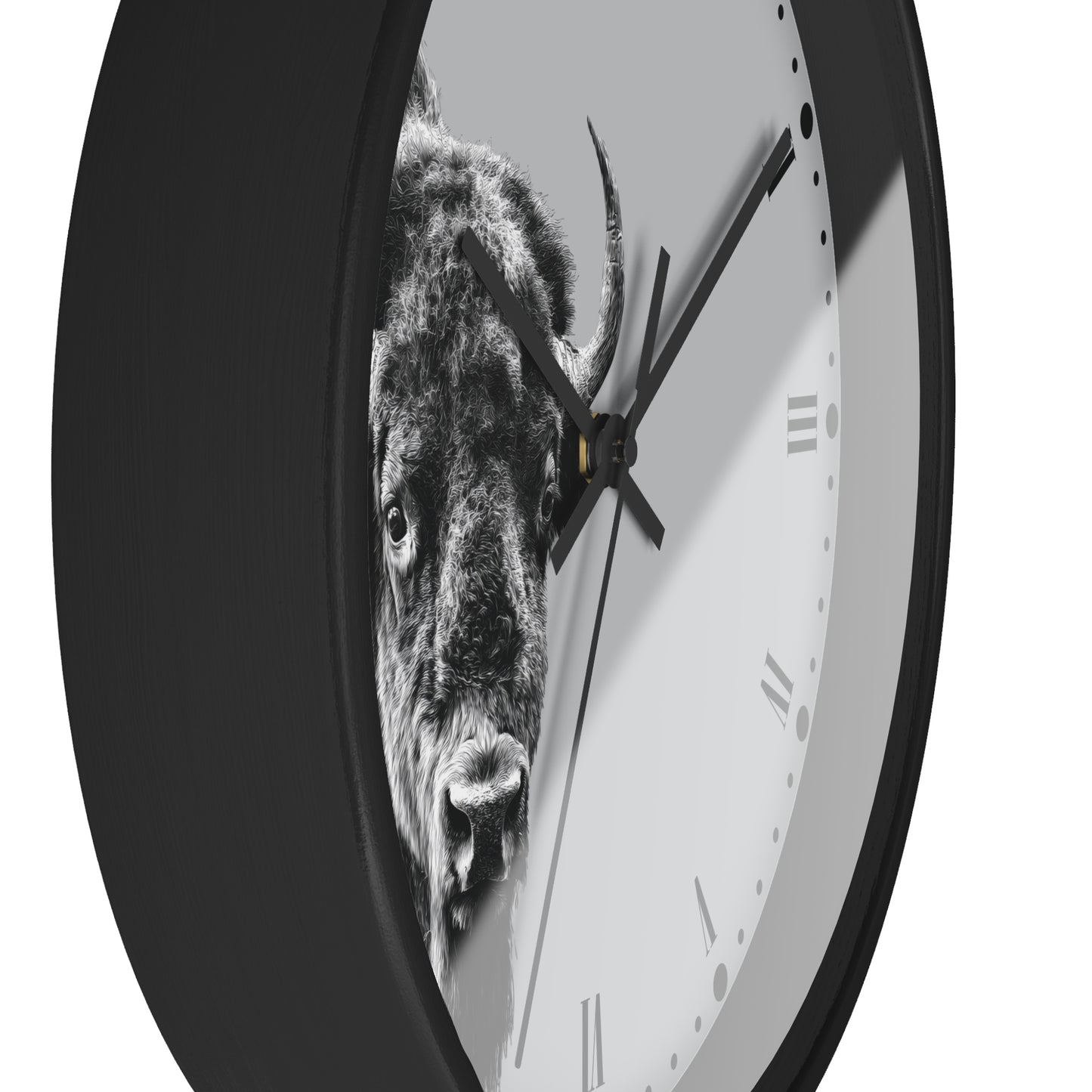 A round wall clock with a black frame and a white face featuring a black-and-white bull graphic. The clock is shown at an angle against a plain white background.