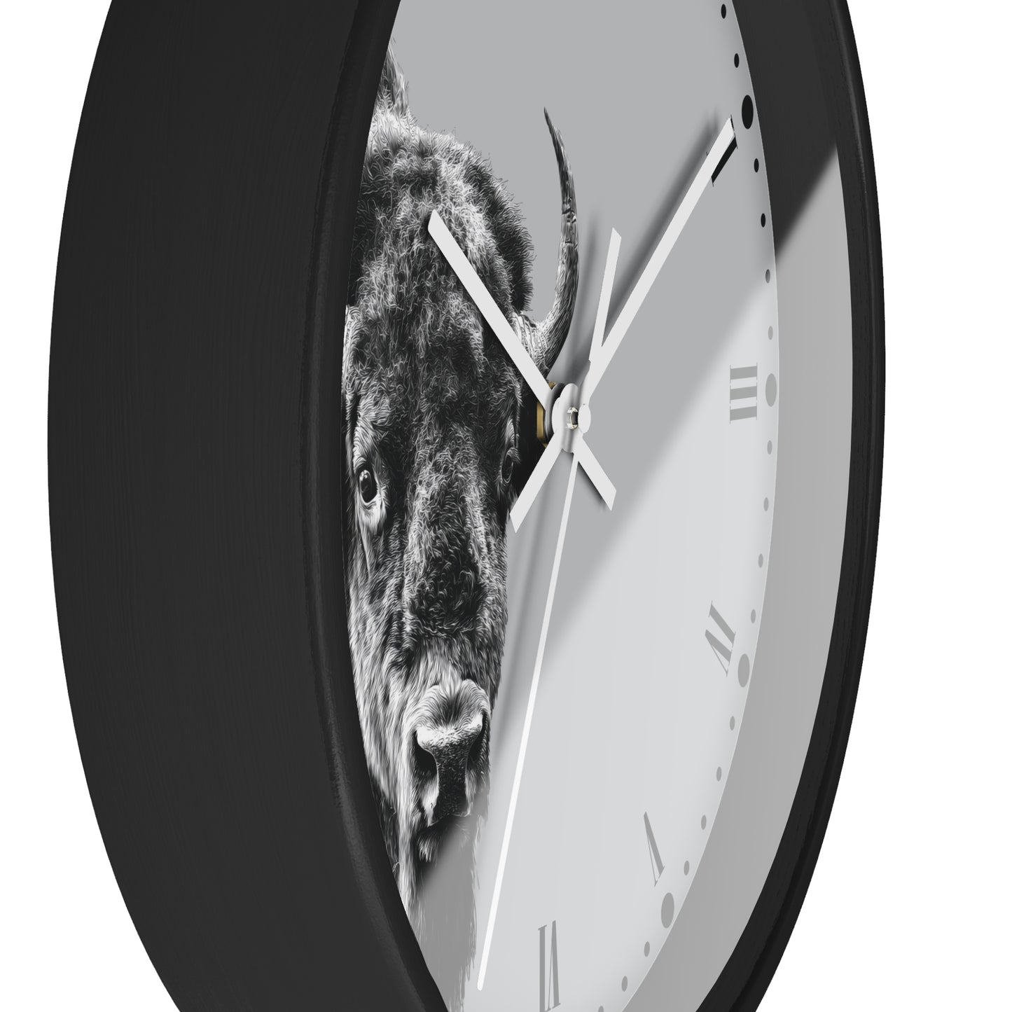 A round wall clock with a black frame and a light gray face featuring a black-and-white bison graphic. The clock is shown at an angle against a plain white background.