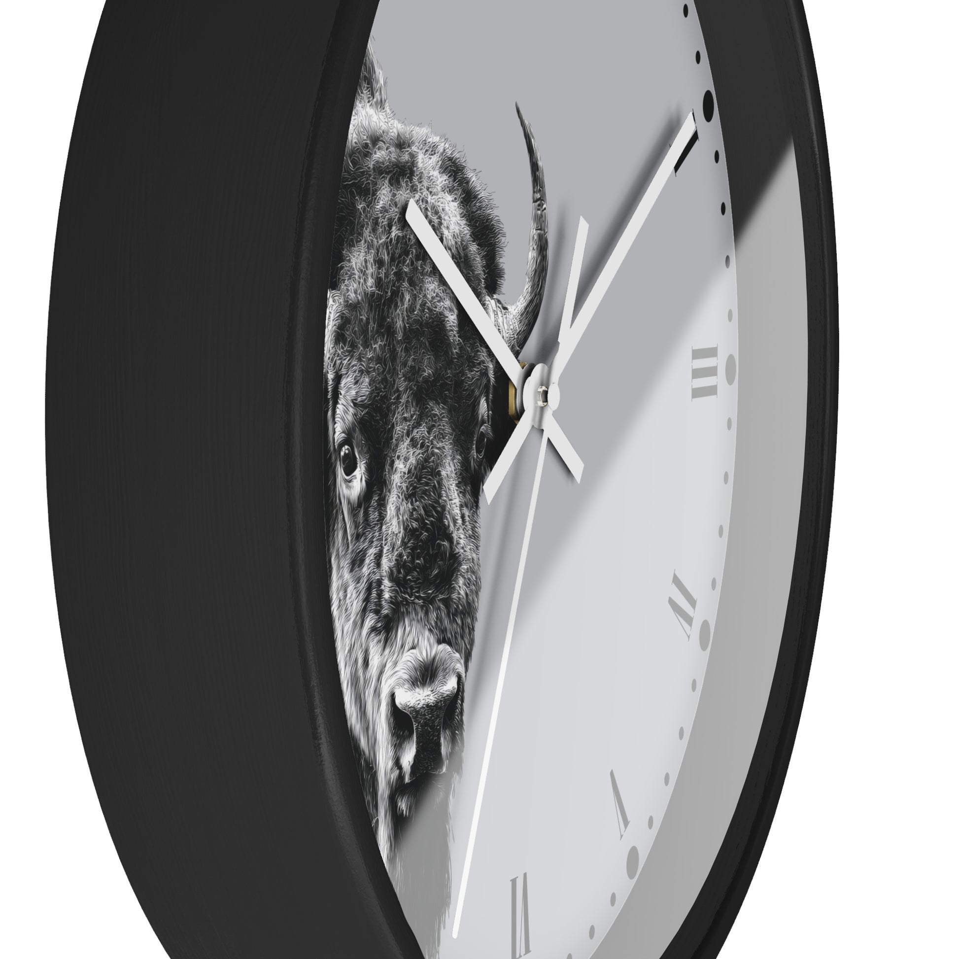 A round wall clock with a black frame and a light gray face featuring a black-and-white bison graphic. The clock is shown at an angle against a plain white background.