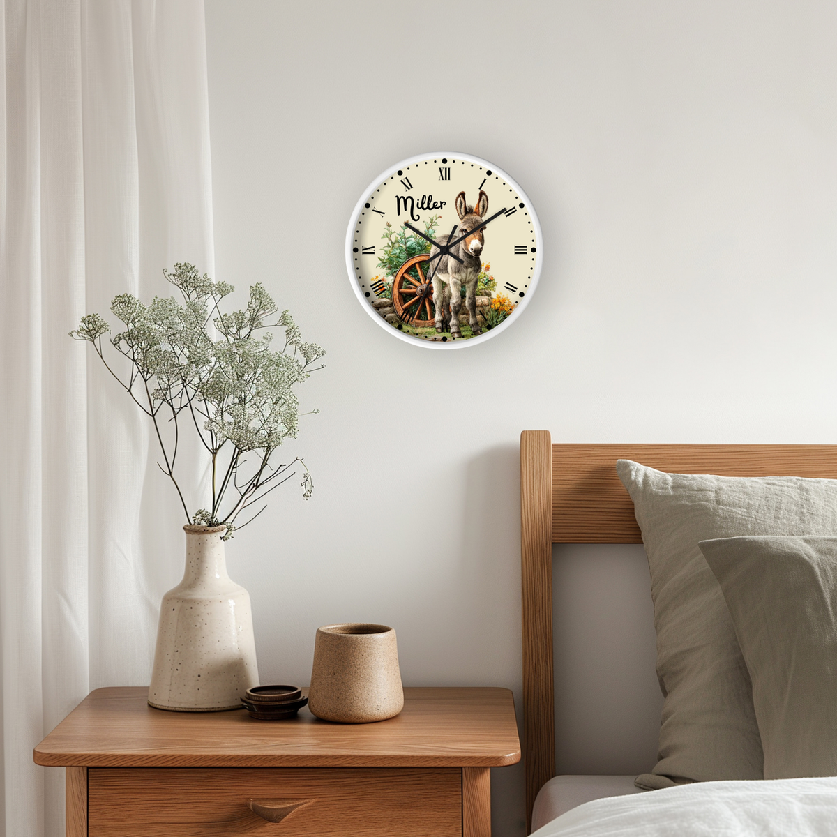 A round wall clock featuring a detailed illustration of a tiger with flowers, mounted on a light gray wall above a wooden nightstand in a bedroom setting.