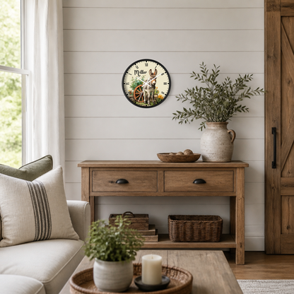 A round wall clock with a rustic illustration of a donkey and the word 'Miller' in a farmhouse-style living room setting above a wooden console table.