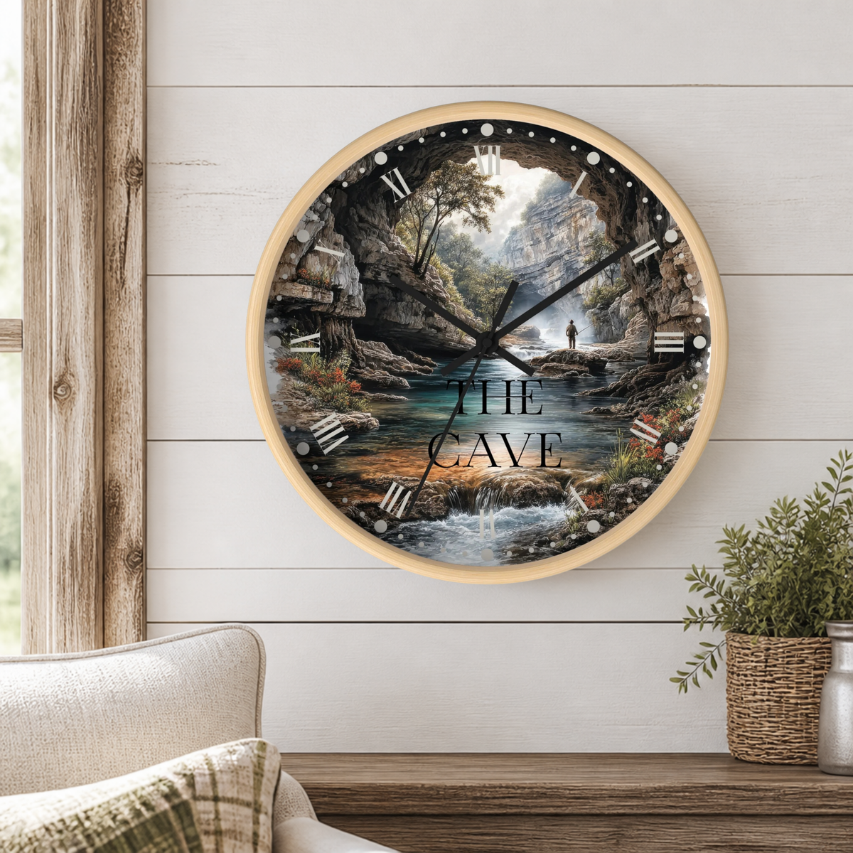 Round wood clock with a detailed angler lustration mounted on a shiplap wall. 
