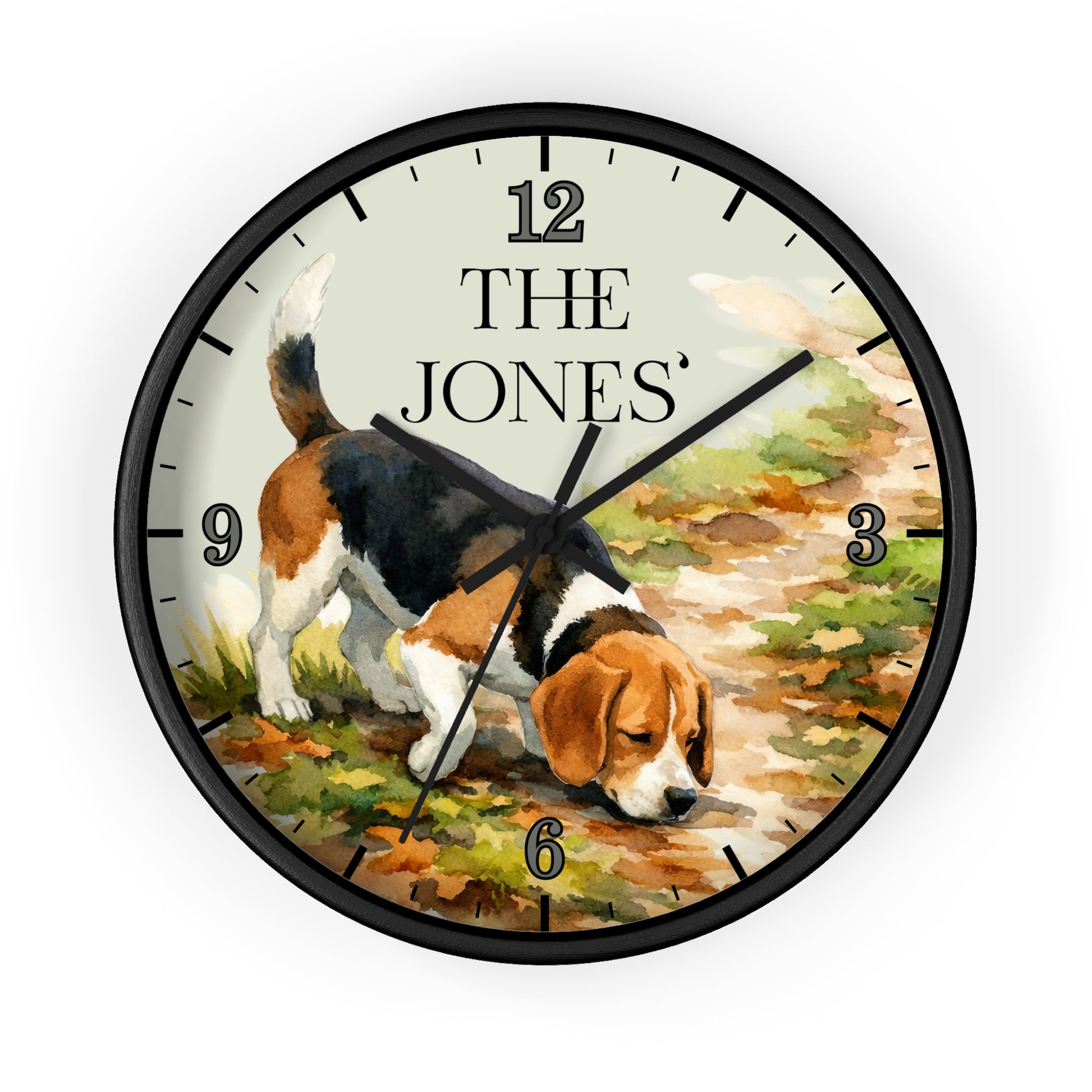 A round wall clock with a black frame and a printed dial showing a beagle dog on a path, with the text 'THE JONES' at the 12 o'clock position. The clock is photographed against a clean white background.