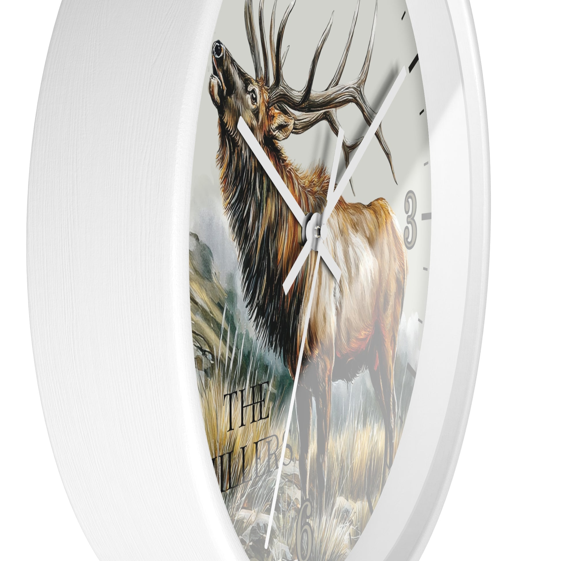 A white round wall clock featuring a detailed illustration of a large elk with antlers on the face, with white hands and black numerals.