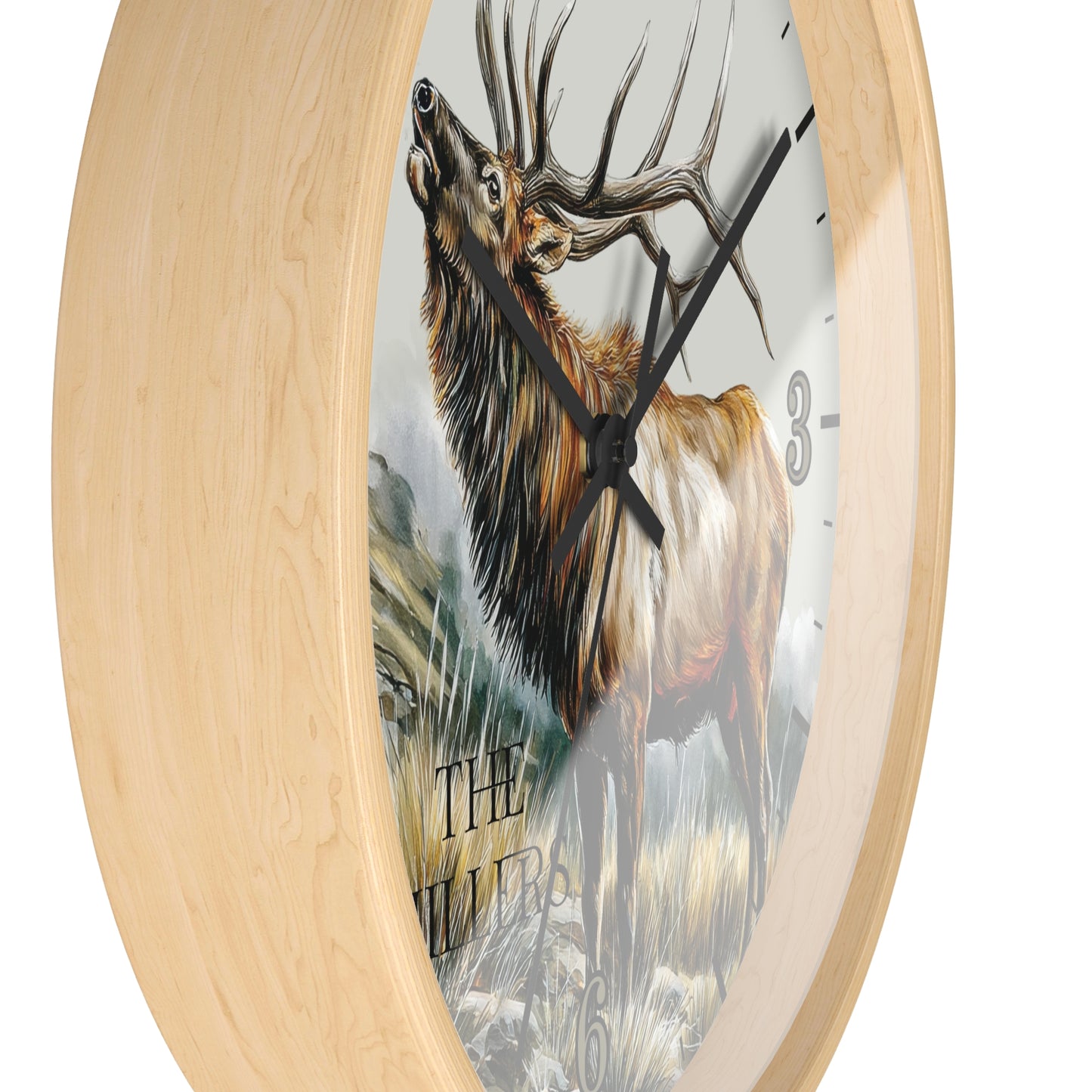 Round wall clock with a light natural wood frame and a printed illustration of a large elk on the face, with black hands and partial black numerals.