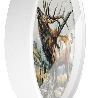 A white round wall clock featuring a detailed illustration of a brown elk deer with large antlers on the clock face, with black hands and partial black Arabic numerals.