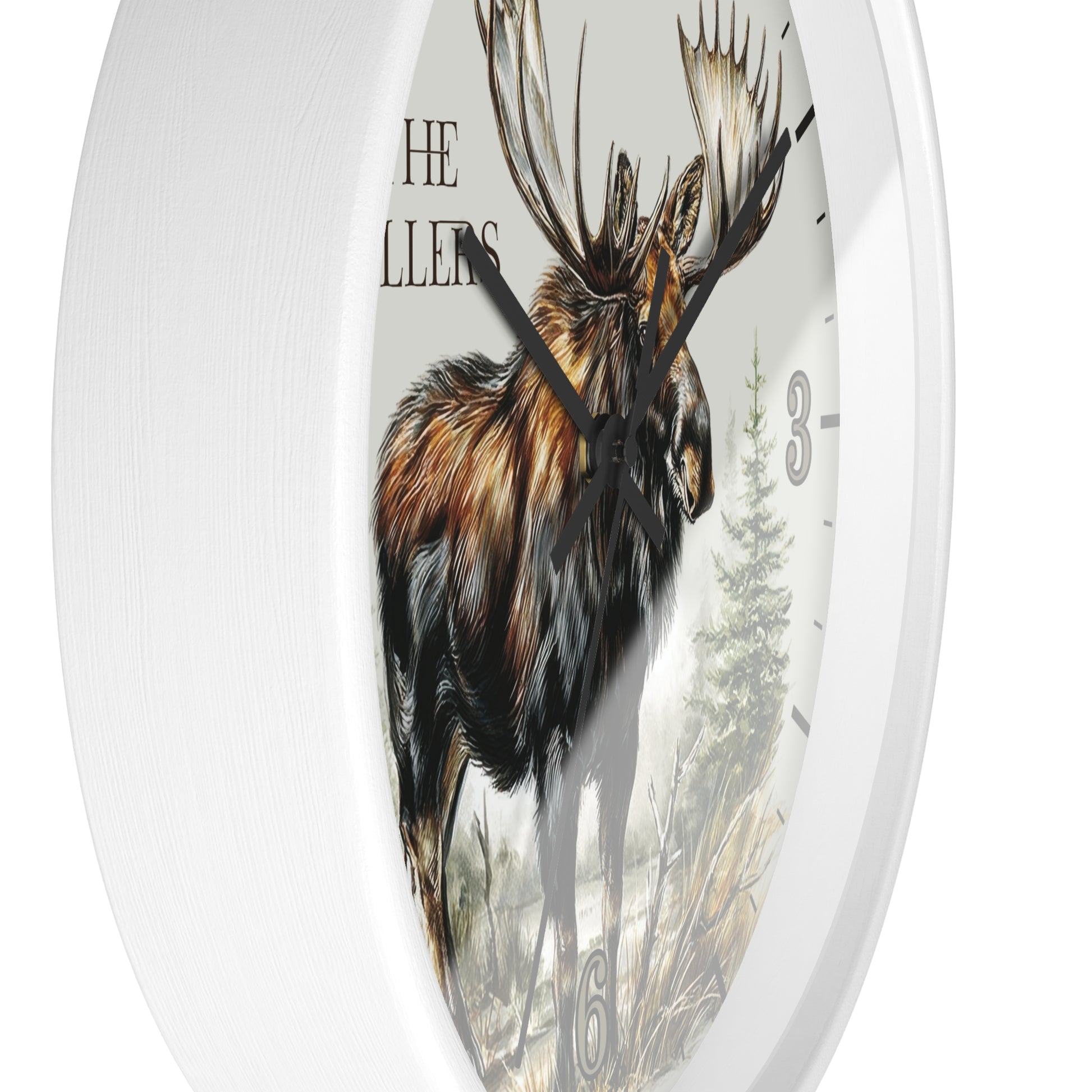 Round white wall clock featuring a detailed illustration of a moose on the face, with black hands, partial black numerals, and the text 'THE MILLERS' near the top left.