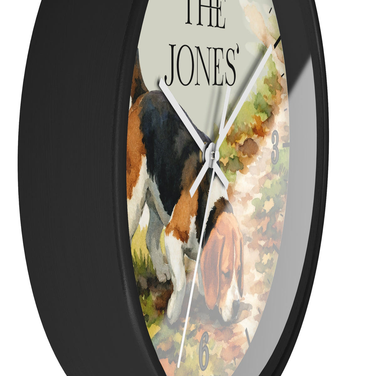 A round wall clock with a black frame and a printed watercolor-style face showing a beagle dog on a path, with the text 'THE JONES' at the top and small gray numbers for hours.