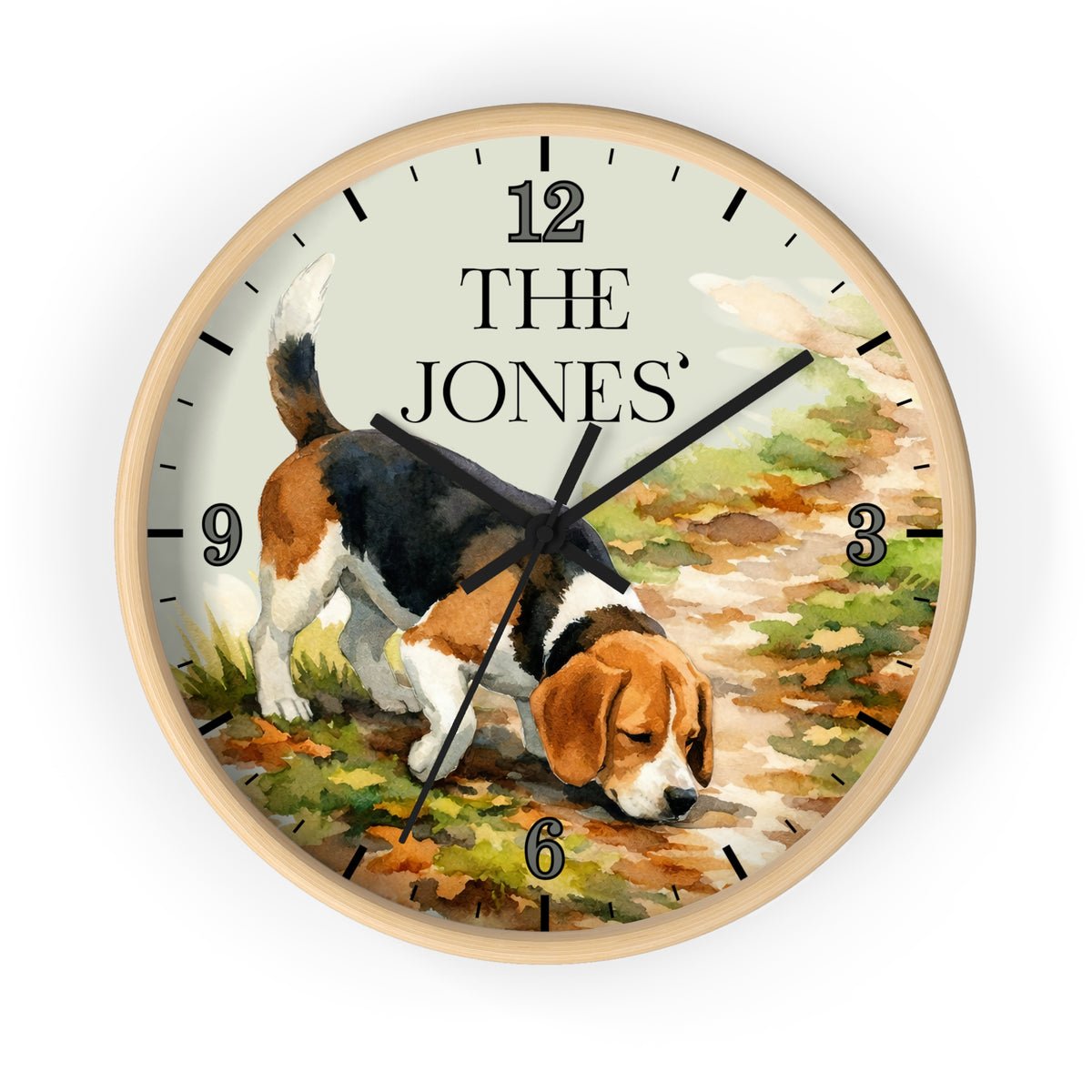 A round wall clock with a light wood frame and a printed illustration of a beagle on the face. The clock face has black Arabic numerals and the text 'THE JONES' at the 12 o'clock position.