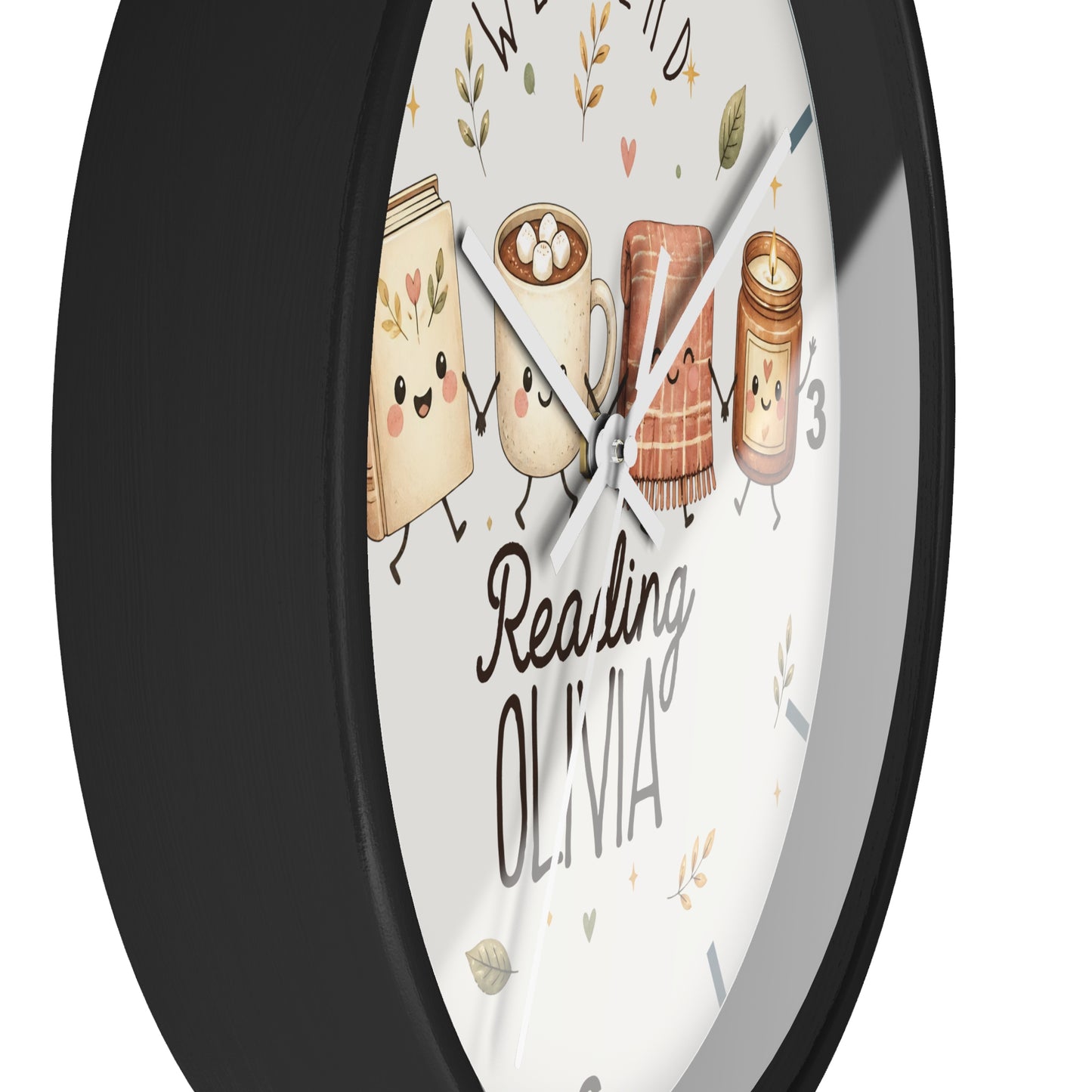 A round wall clock with a black frame and a white face featuring cute illustrated books and mugs, the words 'Reading OLIVIA,' and the name 'Wendy' at the top.