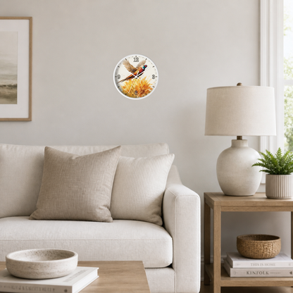 A round wall clock featuring a vintage-style illustration of a fox sitting on a log, mounted on a light gray wall in a modern living room setting with a sofa, side table, and lamp.