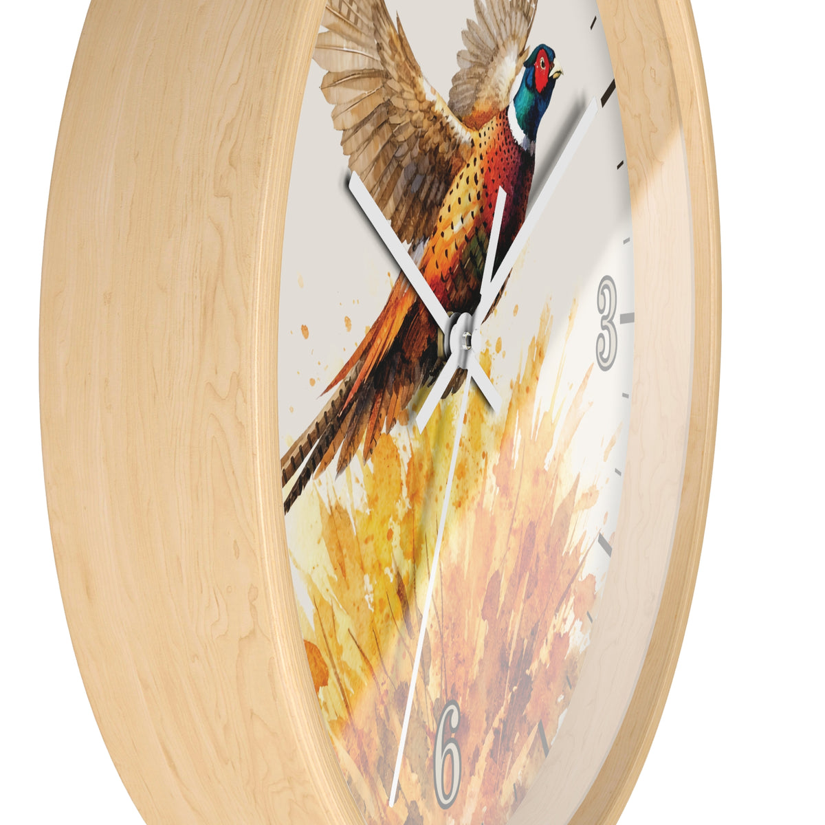 A round wall clock with a light natural wood frame and a printed pheasant artwork on the face. The clock has white hands, black hour markers, and numerals 3, 6, and 9 in a gray font, shown against a plain white background.