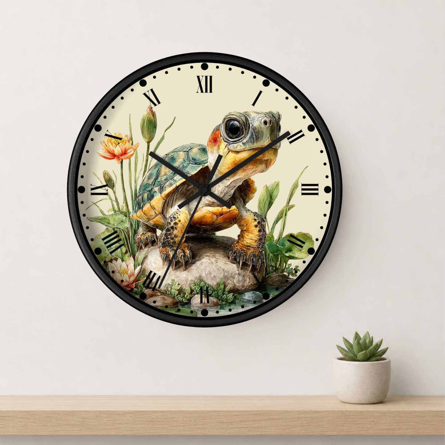 A round wall clock with a black frame and a vintage-style illustration of a turtle on the face, mounted on a light wall above a wooden shelf with a small potted succulent.