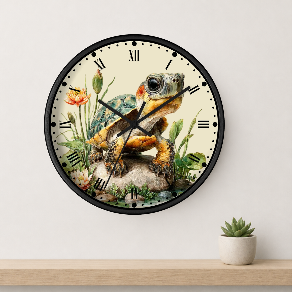A round wall clock with a black frame and a vintage-style illustration of a turtle on the face, mounted on a light wall above a wooden shelf with a small potted succulent.