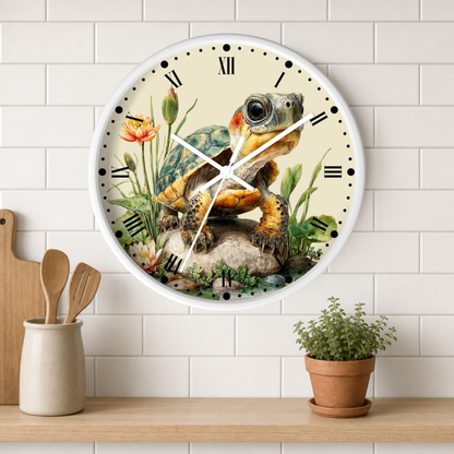 A round wall clock with a white frame and a detailed illustration of a turtle on the face, mounted on a white subway tile wall above a wooden shelf with kitchen utensils and a potted plant.