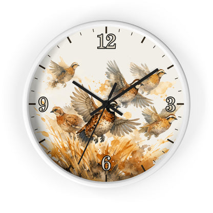 A round wall clock with a white frame and a watercolor-style bird illustration on the face. The design shows several brown and beige birds in flight over a warm tan and orange grassy scene, with black numerals and hands on a white background.