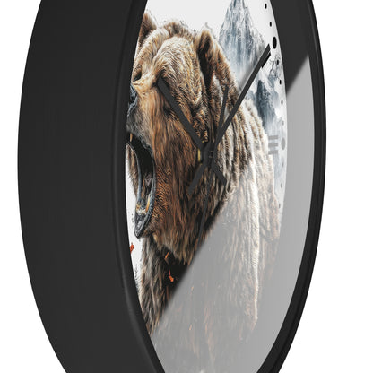 Round wall clock with a black frame and a printed design of a roaring brown bear in front of snowy mountains, shown against a white background.