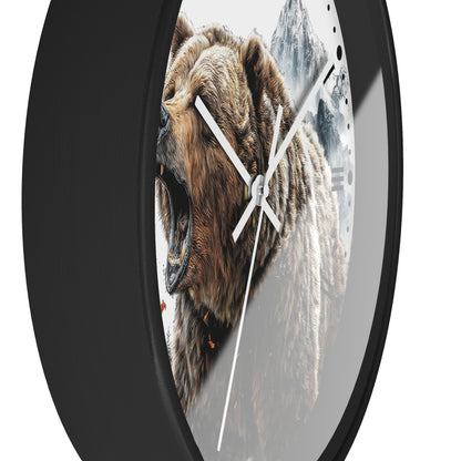 Round wall clock with a black frame and a printed design of a roaring brown bear over a snowy mountain scene, shown against a white background.