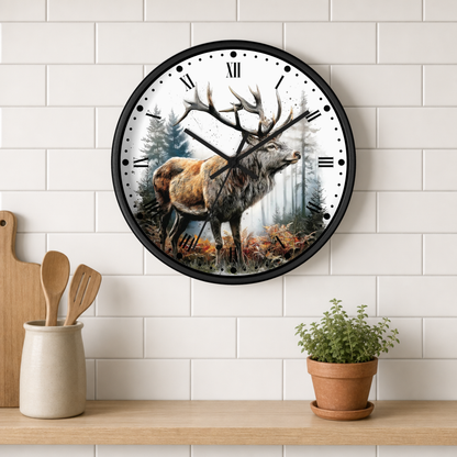 A round wall clock with a black frame hangs on a white subway tile wall above a wooden shelf. The clock face features a detailed illustration of a stag deer in a misty forest.