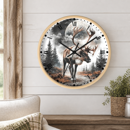 Round wall clock with a light wood frame featuring a detailed illustration of a reindeer under a full moon in a forest, mounted on a white shiplap wall above a wooden mantel with a plant.