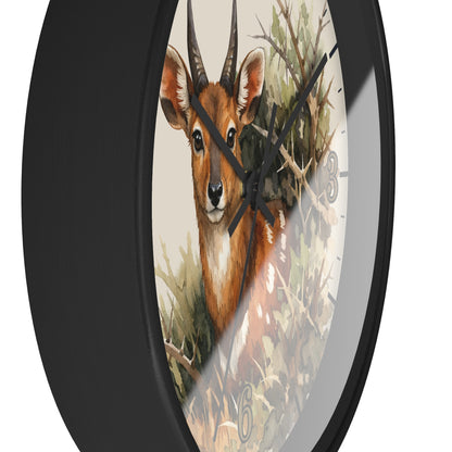 Round wall clock with a black frame and a printed deer illustration on the face, shown against a plain white background.