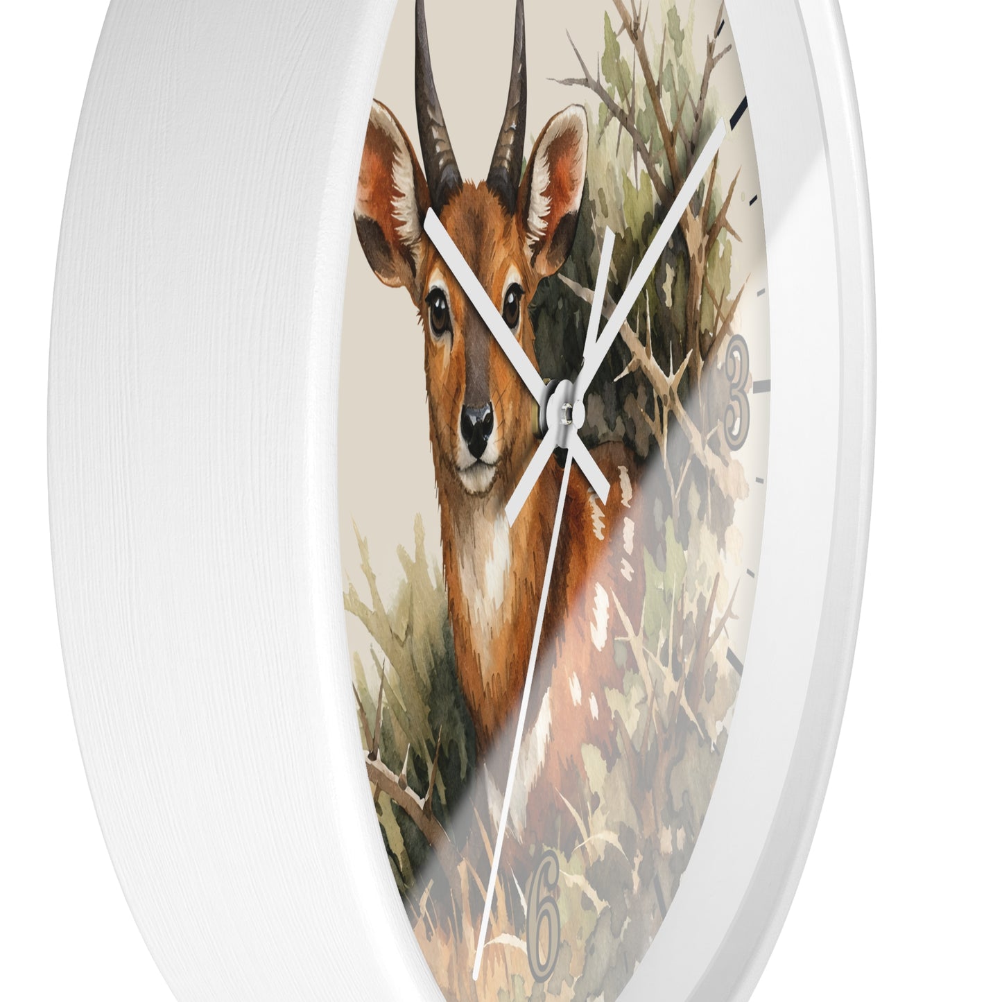 A white round wall clock with a printed illustration of a brown antelope or deer among branches and foliage on the face, shown against a plain white background.