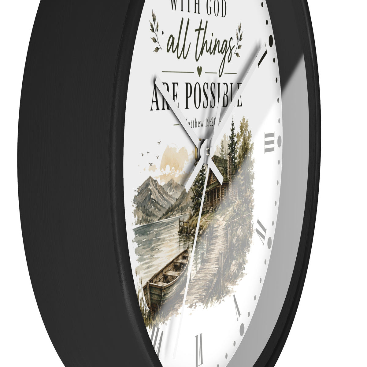 A round wall clock with a black frame and a white face featuring the inspirational quote 'WITH GOD all things ARE POSSIBLE' above a scenic illustration of a cabin by the water.