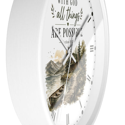 White round wall clock with a scenic mountain lake illustration and the quote 'WITH GOD all things ARE POSSIBLE' on the front.