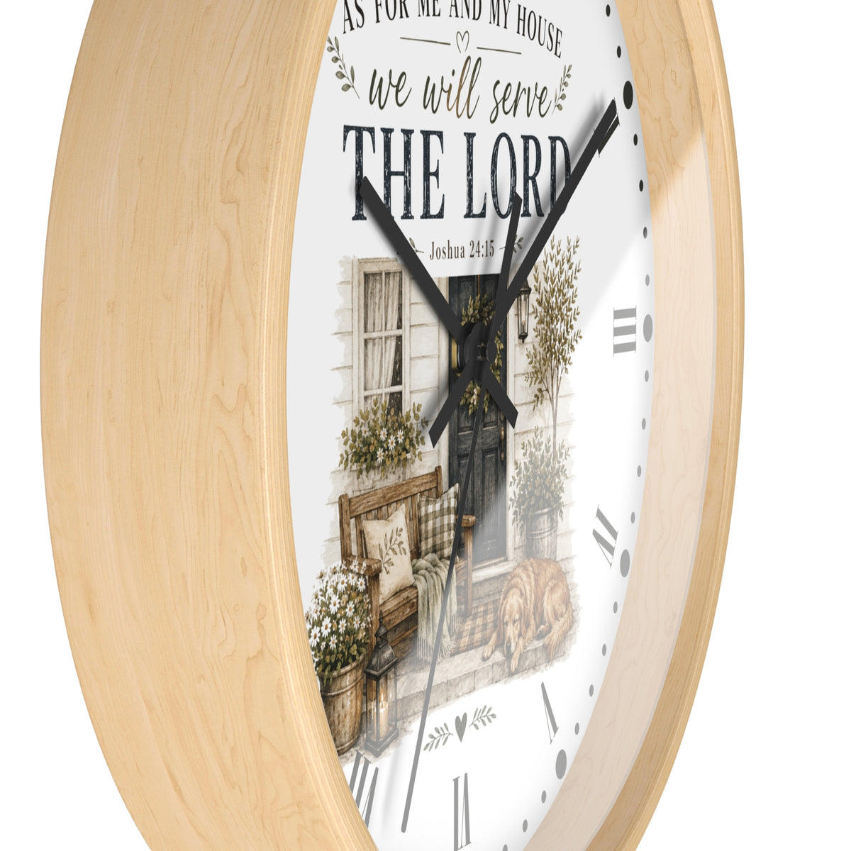A round wall clock with a light natural wood frame and a white face featuring a rustic illustration of a front door, bench, flowers, and the text 'AS FOR ME AND MY HOUSE we will serve THE LORD'.