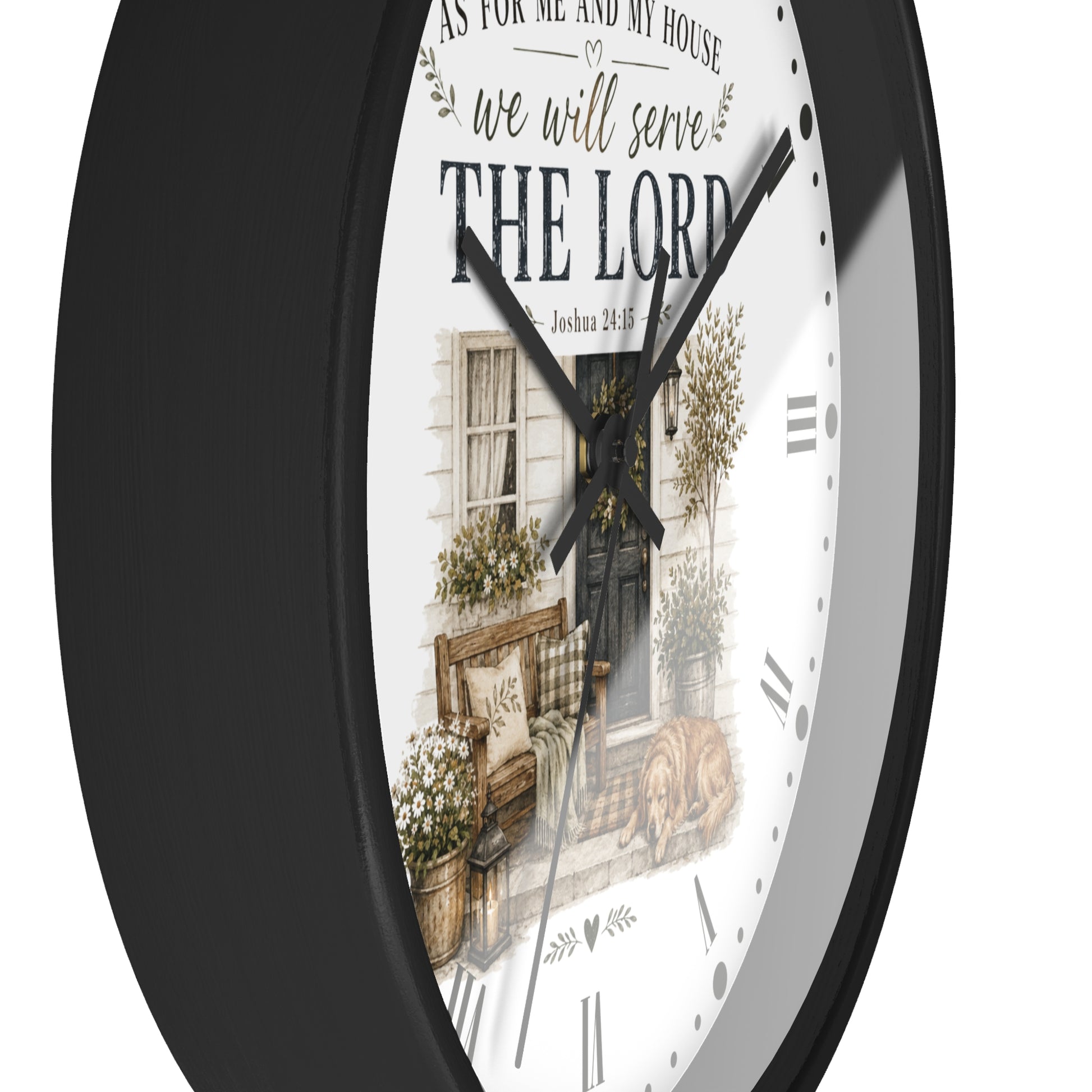 A round wall clock with a black frame and a white face featuring a rustic illustration of a front porch and the text 'AS FOR ME AND MY HOUSE we will serve THE LORD'.