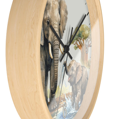 A round wall clock with a light natural wood frame and a printed elephant scene on the face, showing one large elephant and one smaller elephant near water, with black hands and no visible numbers except a small '6'.