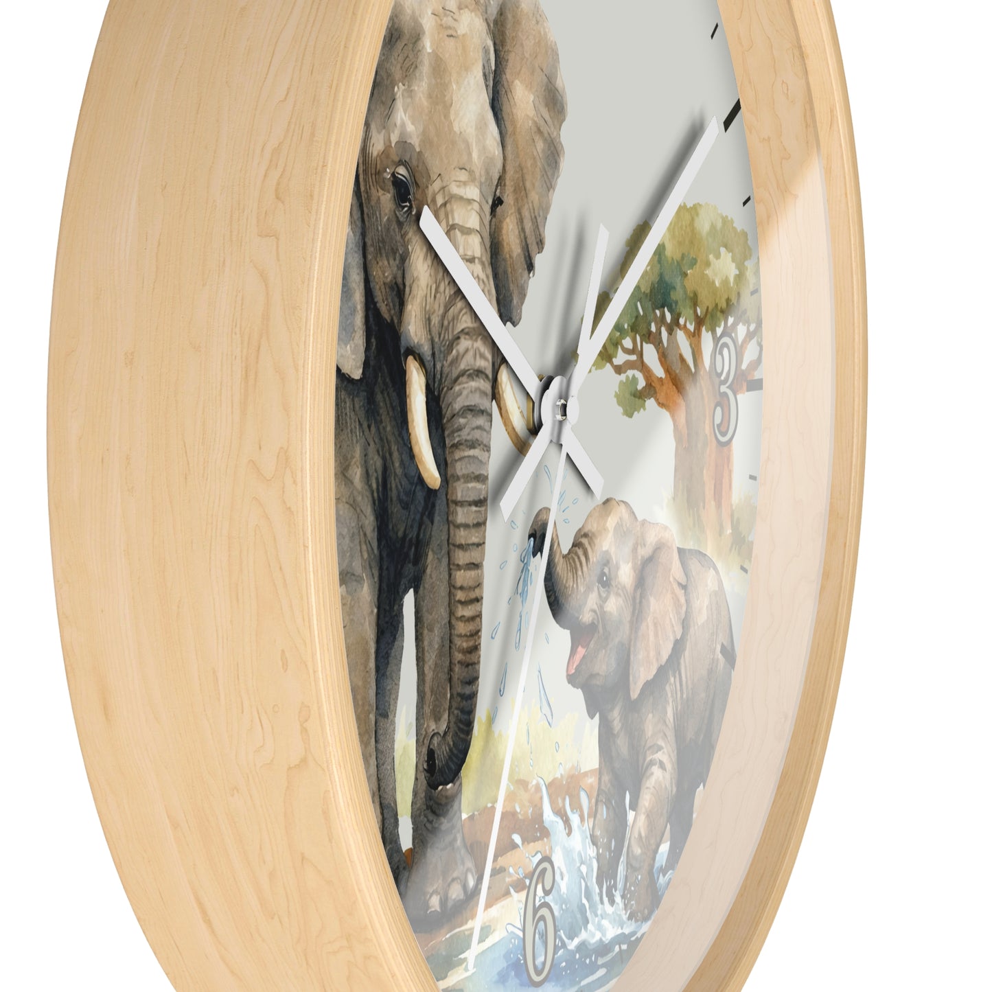 Round wall clock with a light natural wood frame and a printed elephant scene on the face, including a large elephant, a baby elephant, water, and trees. The clock is shown against a plain white background.