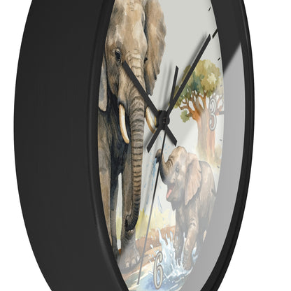 A round wall clock with a black frame and a printed safari scene featuring two elephants, one adult and one young, along with a tree and water. The clock is shown at an angle against a plain white background.