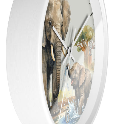A white round wall clock featuring a printed illustration of two elephants and a tree on the face, with white hands and black Arabic numerals.