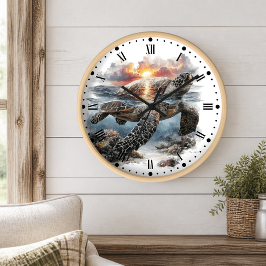 A round wall clock with a light wood frame hangs on a white shiplap wall. The clock face features a detailed illustration of a sea turtle swimming through ocean water toward a sunset, with black Roman numerals and hands.