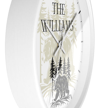 Oval wall clock with a white frame and a custom printed face featuring a forest design with a horse and bear, the text 'THE WILLIAMS', and black hands.