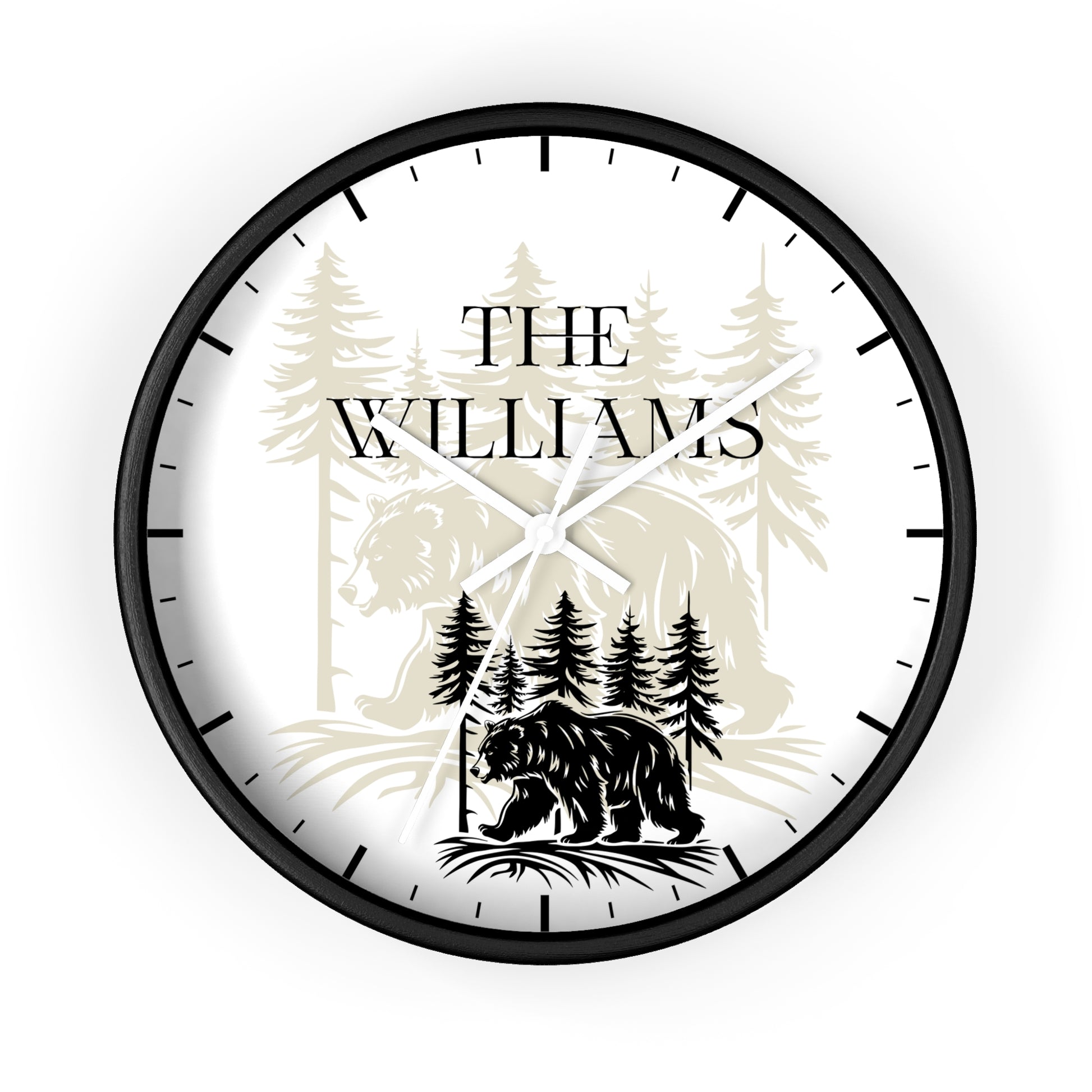 A personalized round wall clock with a black frame and black hands, featuring a white face with a black bear silhouette, pine trees, and the text 'THE WILLIAMS'.