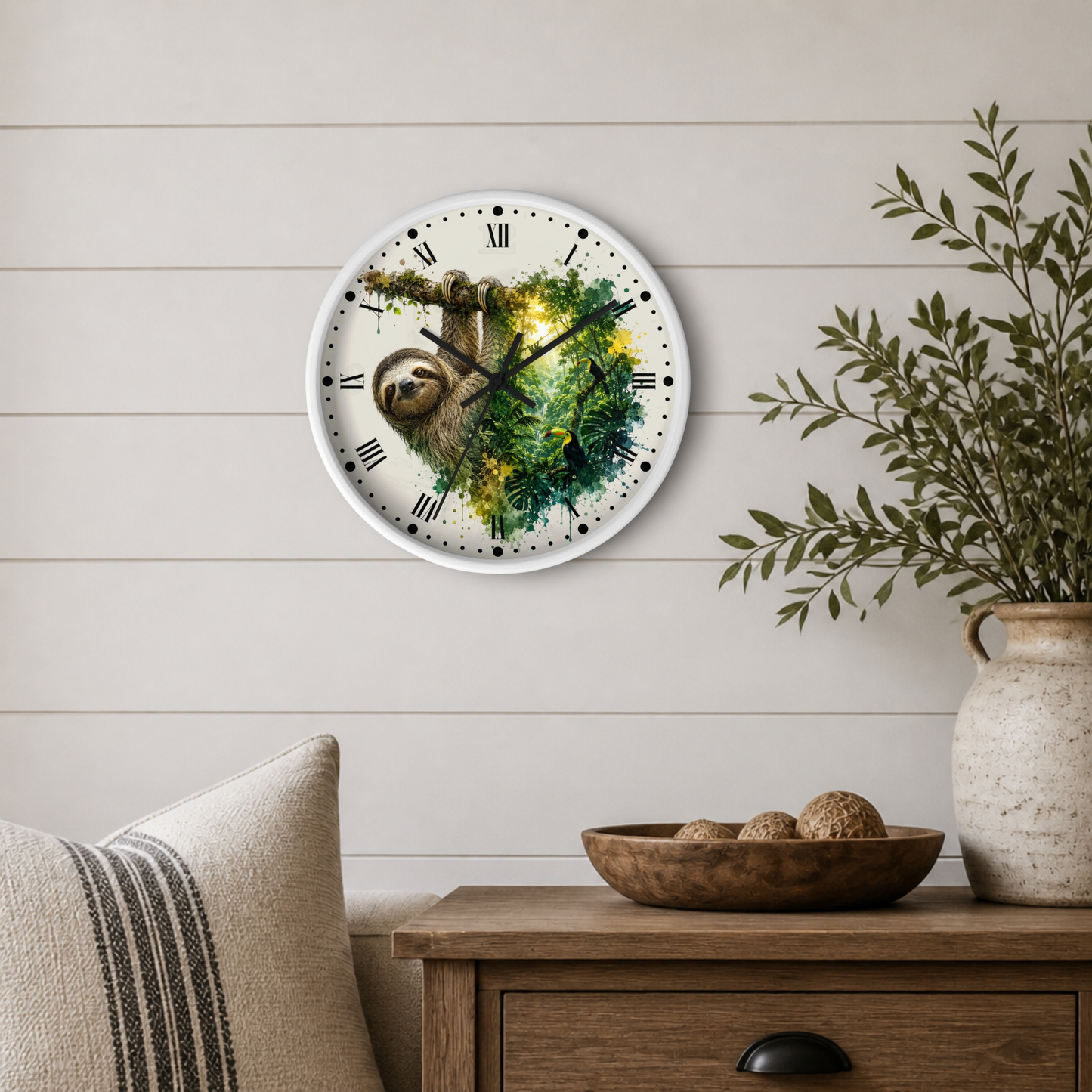 A round wall clock with a white frame and a watercolor-style tiger illustration on the face, mounted on a light beige shiplap wall above a wooden side table with a vase and bowl.