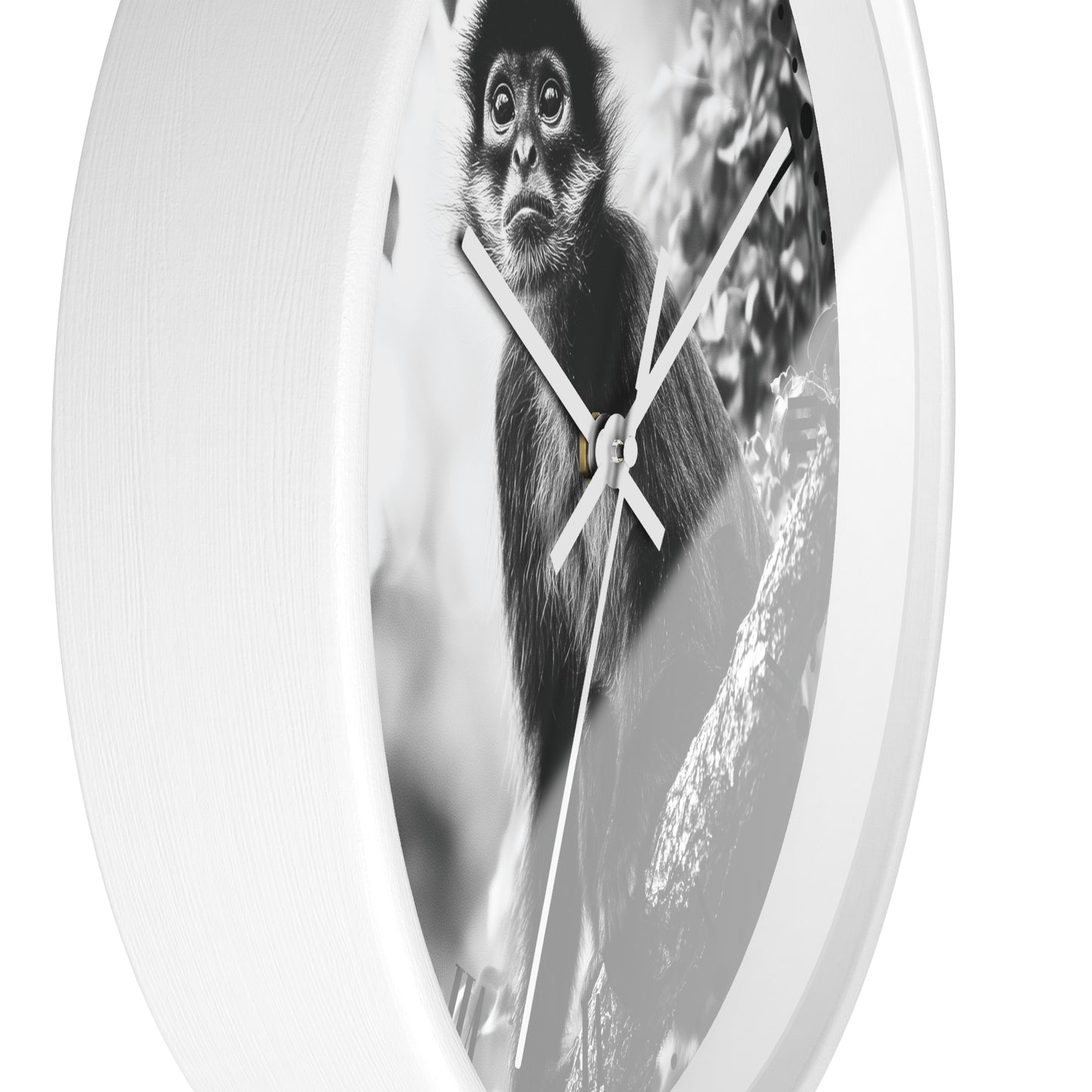 Round wall clock with a white frame and a black-and-white photographic print of a monkey on the face, shown against a plain white background.