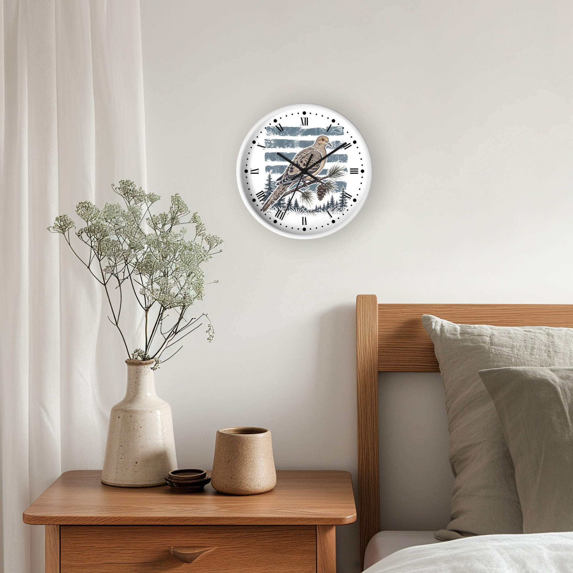 A round wall clock with a dove bird illustration and Roman numerals, mounted on a light gray wall above a wooden nightstand in a bedroom setting.