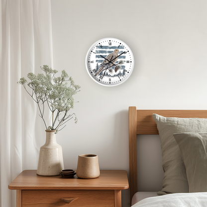 A round wall clock with a dove bird illustration and Roman numerals, mounted on a light gray wall above a wooden nightstand in a bedroom setting.