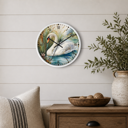 A round wall clock with a white swan illustration on the face, mounted on a light wood shiplap wall above a wooden side table with a plant and decorative bowl.